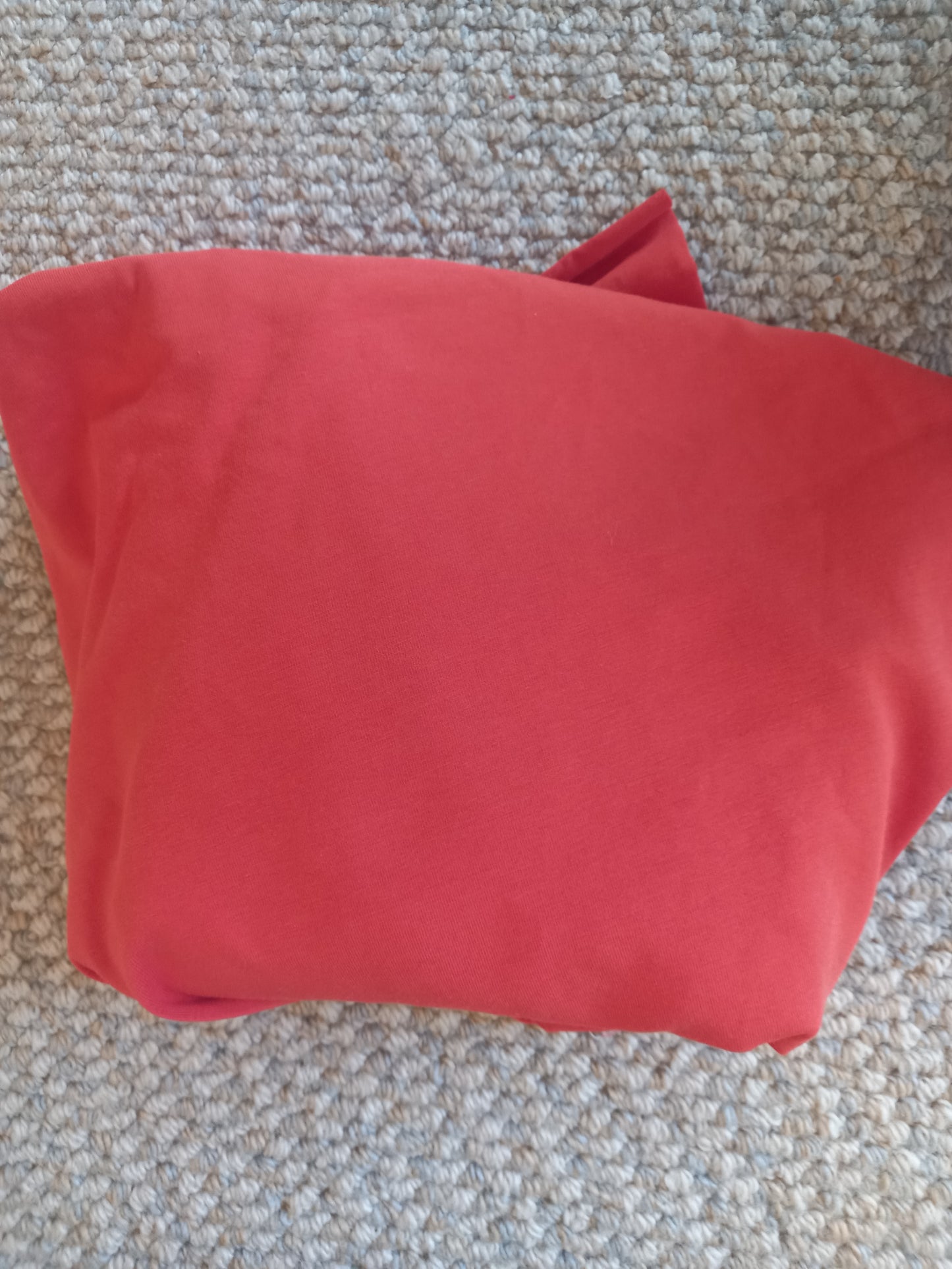 Orange Cotton Spandex - 1.23 remnant - hole in it, photographed