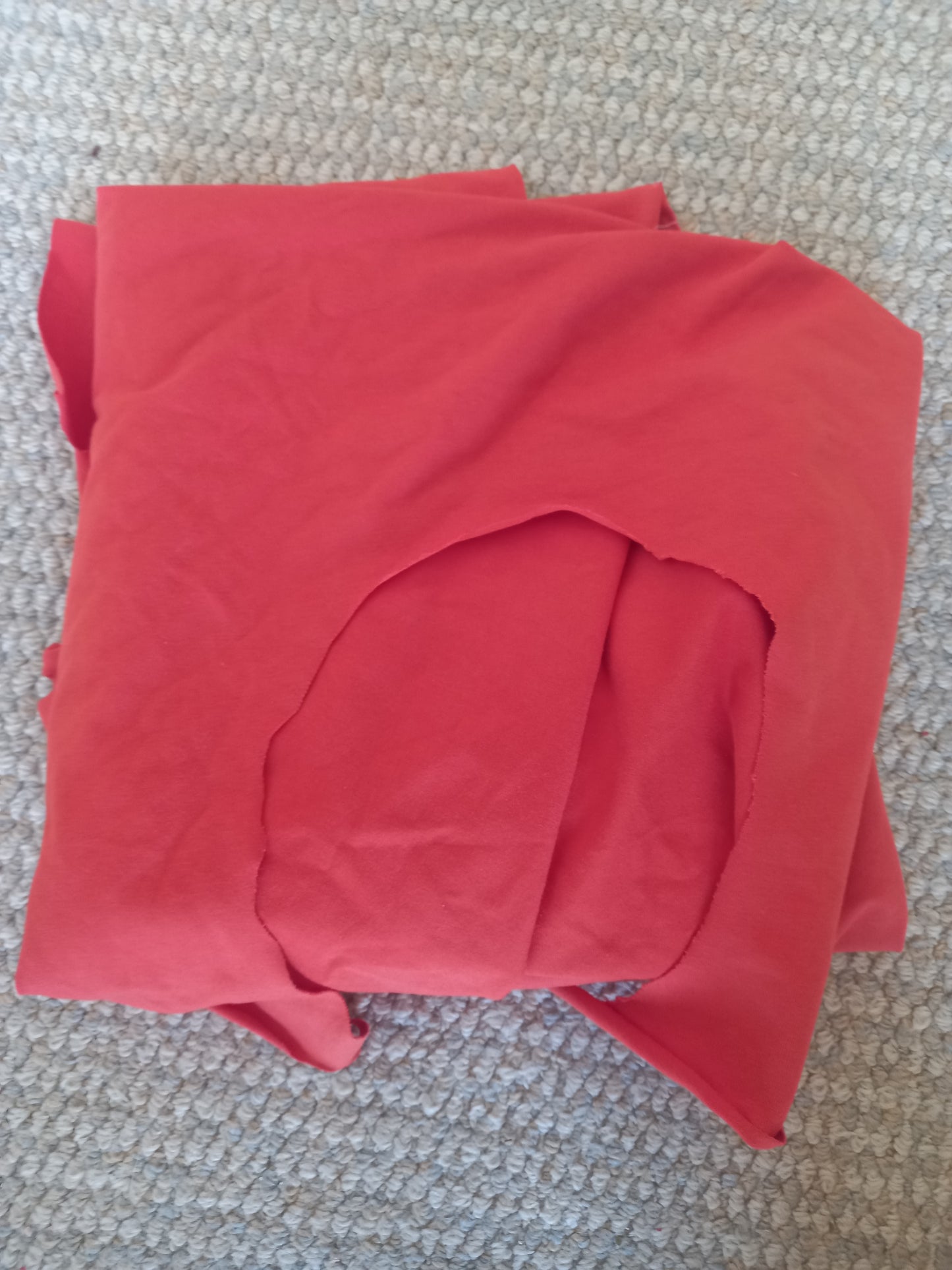 Orange Cotton Spandex - 1.23 remnant - hole in it, photographed