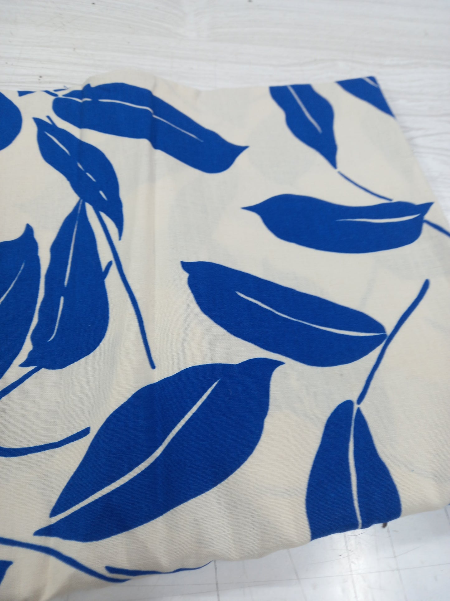 Neon Blue Leaves on white background 100% Linen - 1 metre remnant